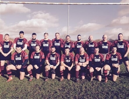picture of the Pinley Rugby Football Club team on a rugby pitch near the goal